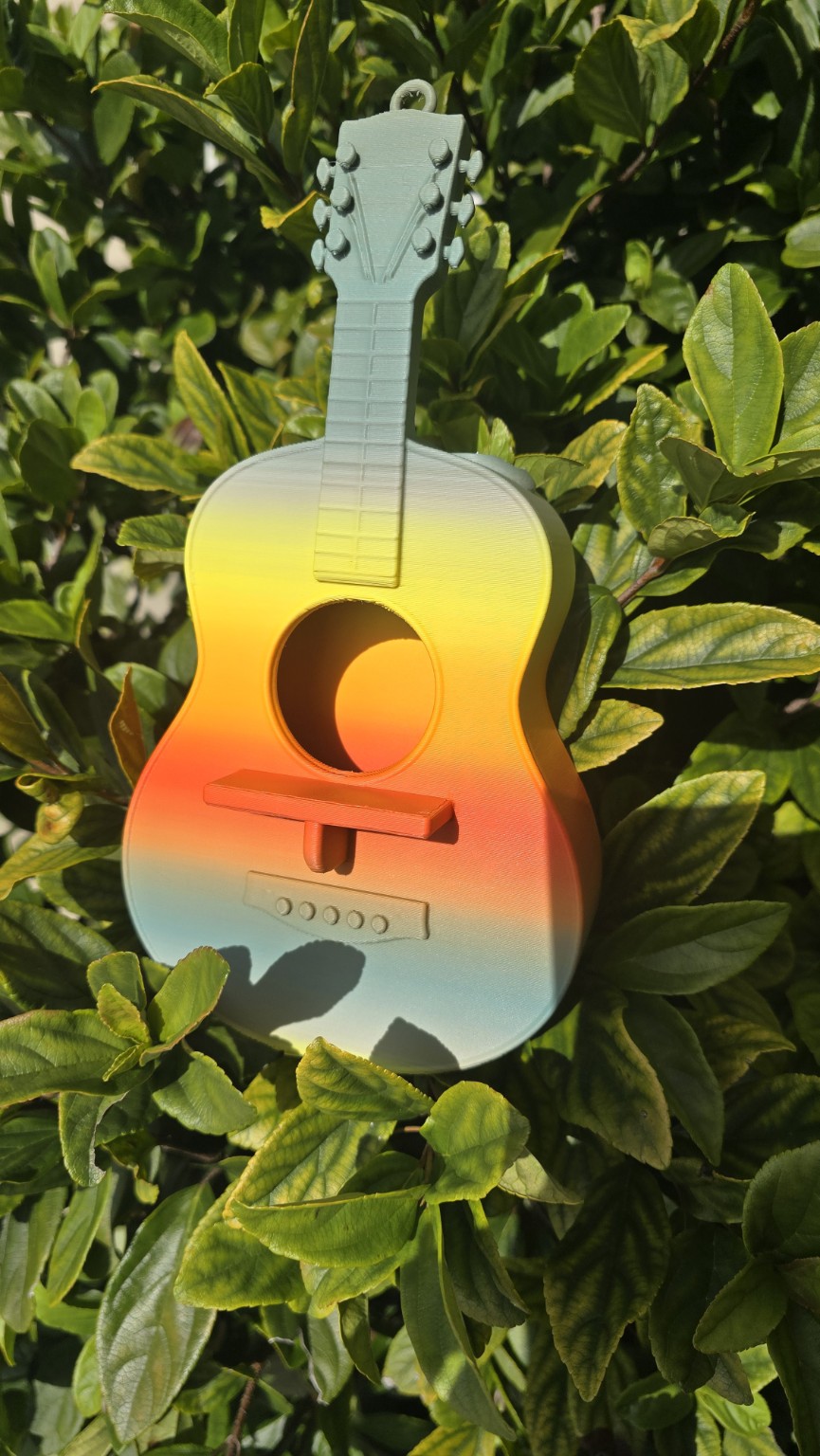 Sunset-colored guitar-shaped 3D printed bird feeder