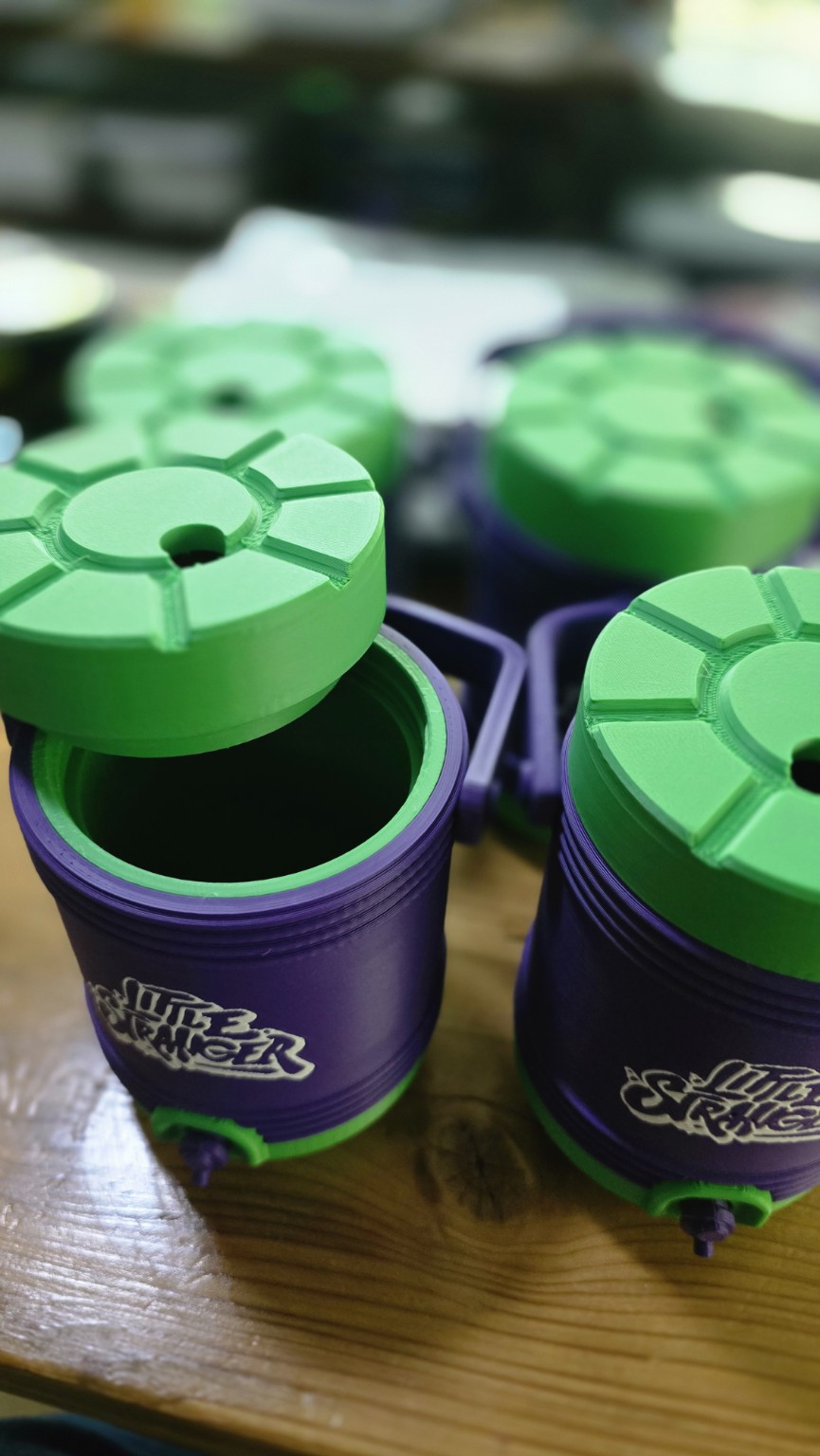 Collection of purple and green Little Stranger 3D printed containers