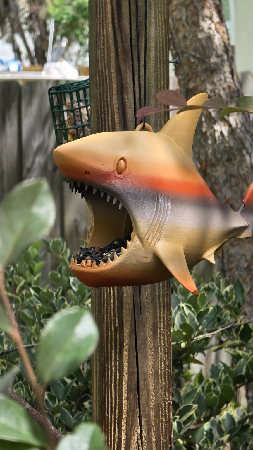 3D printed shark decoration attached to a tree