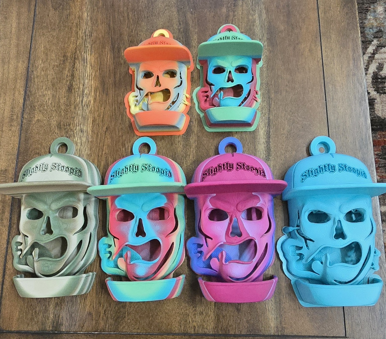 Collection of colorful custom skull bird feeders