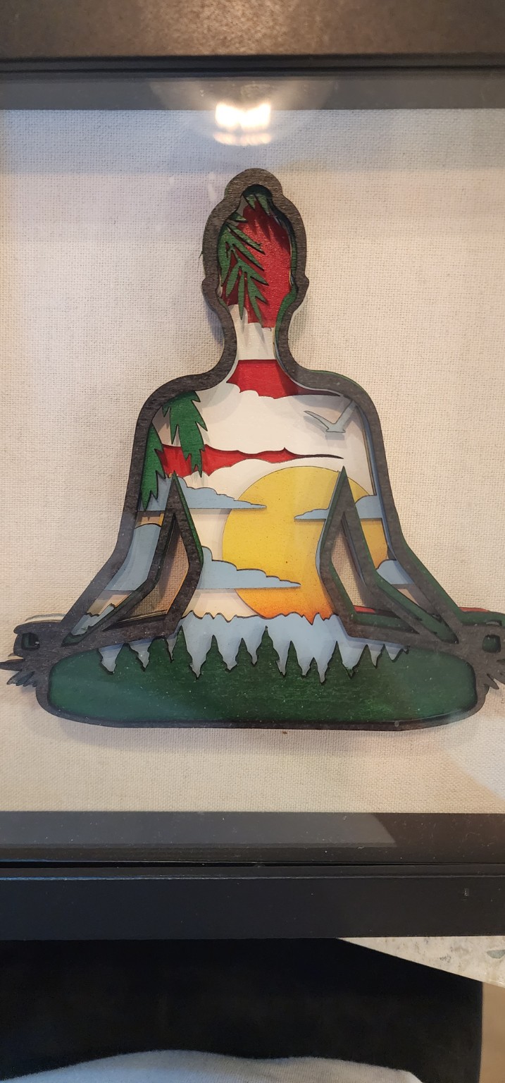 Colorful layered meditation figure artwork