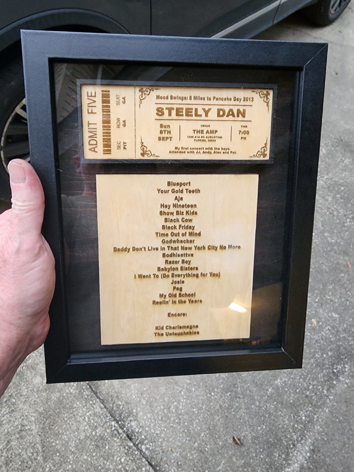 Concert ticket and set list preserved in a custom shadowbox