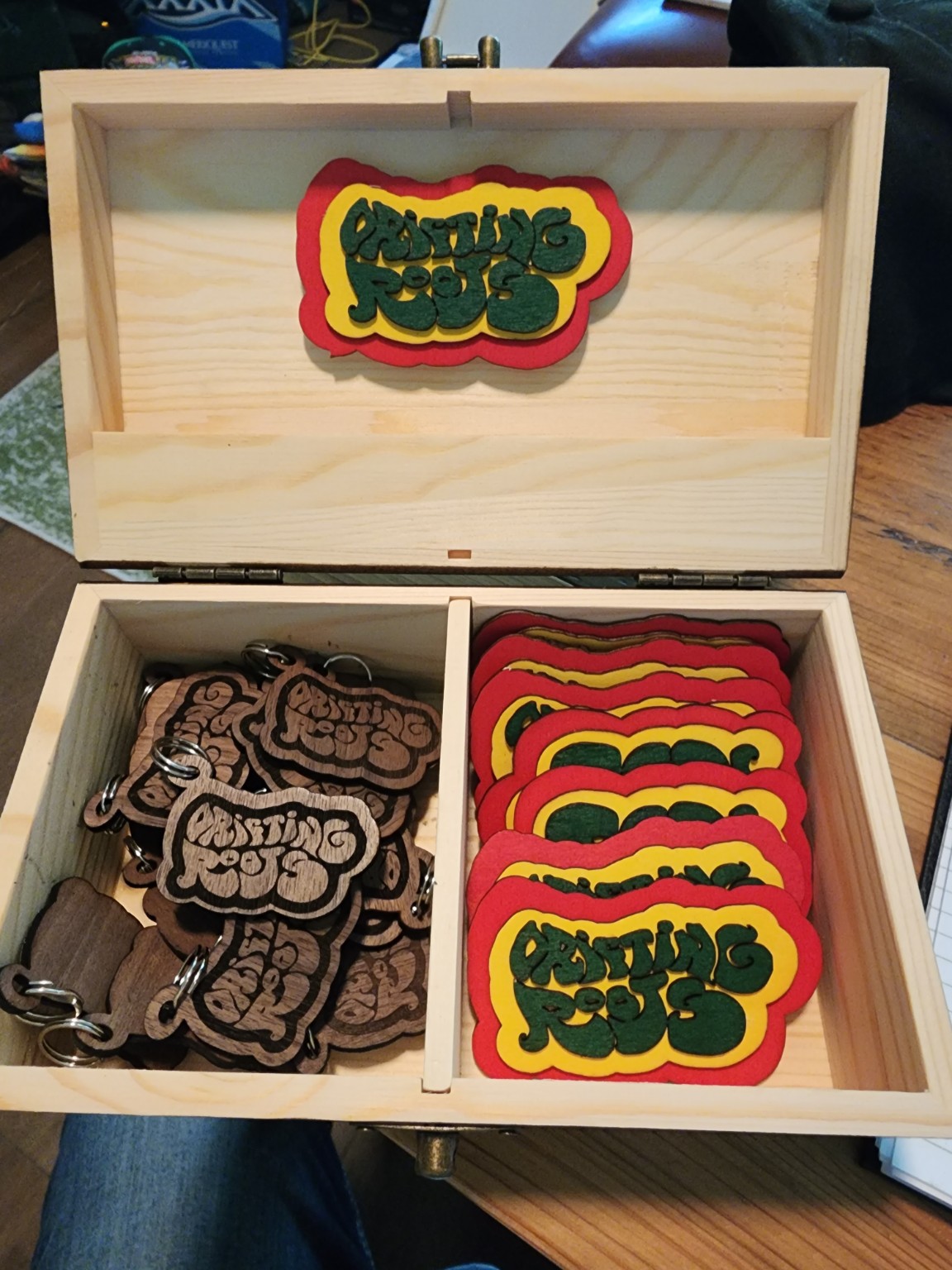 Wooden gift box filled with colorful custom engraved coasters