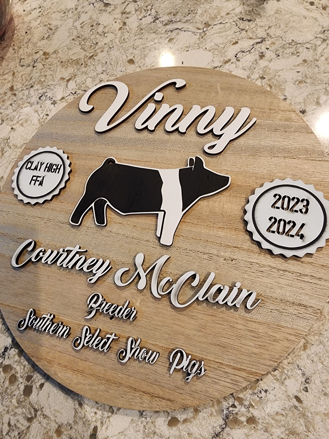 Personalized livestock award sign engraved on round wood